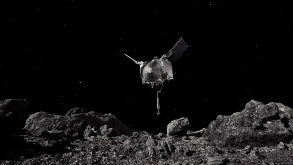 Visualización oficial de NASA de la nave OSIRIS-REx descendiendo hacia el asteroide Bennu